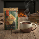 Hot chocolate package and steaming mug on a wooden surface with a fireplace in the background